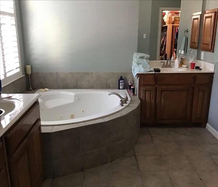 Before photo of a customer bathroom that was remodeled by our expert reconstruction and remodeling team